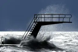epa08208569 Waves hit a diving board on the shore of Lake Geneva, in Lutry, Switzerland, 10 February 2020, during storm Ciara. Severe warnings have been issued for Western and Northern Europe as storm Ciara -- also known as Sabine in Germany and Switzerland, and Elsa in Norway -- is bringing strong winds and heavy rains causing disruption of land and air traffic. Winter storm Ciara reached Switzerland last night.  EPA-EFE/LAURENT GILLIERON