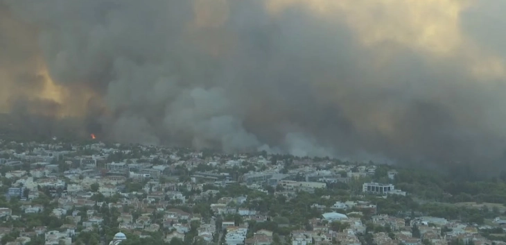 Emergency services battle huge fire raging through suburban Athens