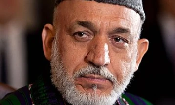 Karzai calls on Biden to reverse decision on frozen Afghan assets