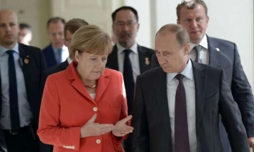 Merkel decries Ukraine invasion in first post-office interview