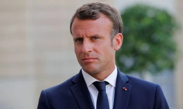 Macron urges French to face up to 'upheaval' during multiple crises