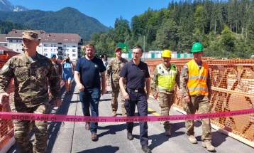 Macedonian soldiers help construct temporary bridge in Slovenian town