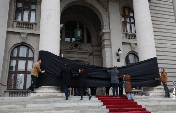 Silent protest in Serbia over station collapse that killed 14 people