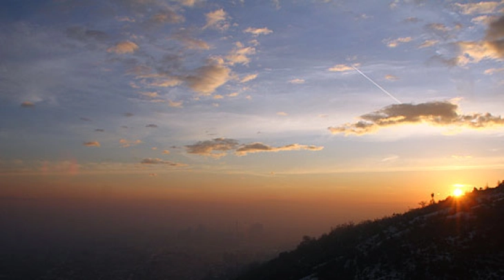 Sunny and warm with fog in valleys