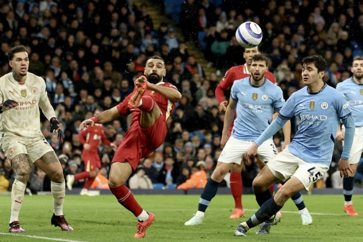 Liverpool move 11 points clear at the top after easing past City