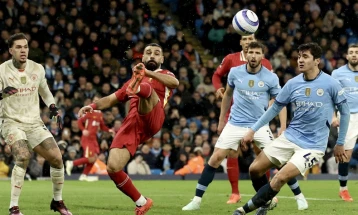 Liverpool move 11 points clear at the top after easing past City