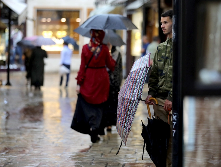 Cloudy skies, scattered rain