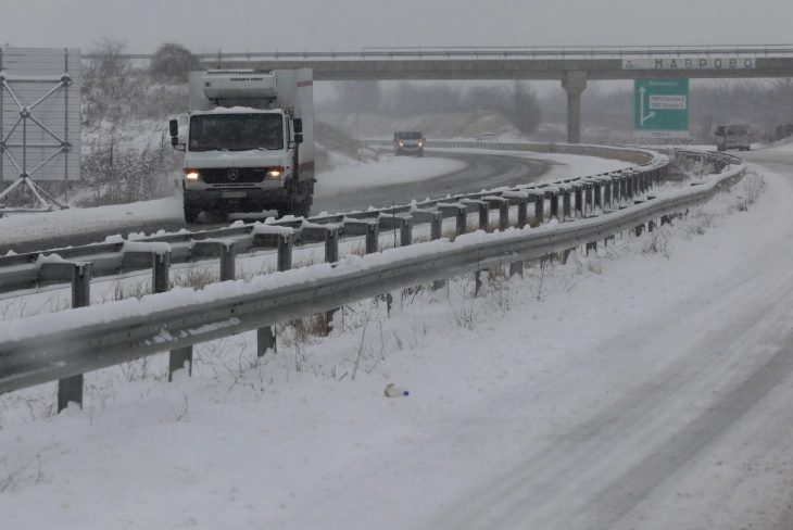 Snow hinders traffic, trucks banned on several roads
