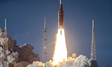 Manned mission to moon fires engines to leave Earth's orbit